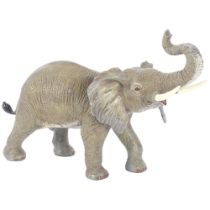 An Oriental painted bronze trumpeting elephant, H22cm