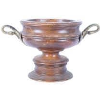 A large turned and stained wooden table centre, with brass swan neck handles. H - 23cm.