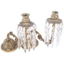 A pair of embossed brass table candelabra with glass lustres. H - 22cm.