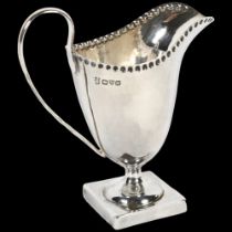 An Edward VII silver cream jug, hallmarks for Chester 1908, maker's marks for Nathan & Hughes, H10cm