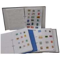 A large quantity of world stamps across 13 albums.