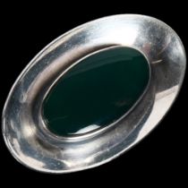 NIELS ERIK FROM - a Danish modernist sterling silver and green agate concave disc brooch, 43.6mm,