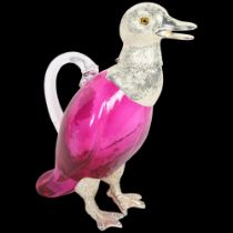 A Claret jug in the form of a duck, with plated mounts and red glass body, H26cm