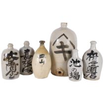 A group of 6 Sake bottles, various sizes, largest 40cm