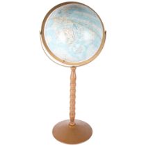 A Replogle world nation series terrestrial 12 inch globe on stand.
