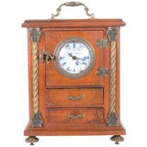 A stained wood jewellery box with an inset quartz movement clock. The hinged door opening to a