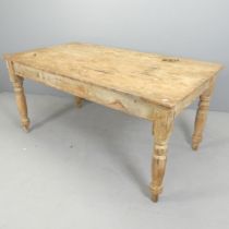 A Vintage pine scrub-top farmhouse kitchen table. 160x76x86cm. Appears to have been stored somewhere