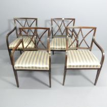 A set of four of mid-century mahogany and brass line inlaid open arm or desk chairs.