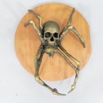 CLIVE FREDRIKSSON - A painted resin sculpture "Skull-spider". Approximately 55x65x28cm.