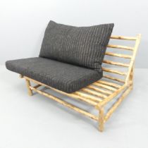 A two-seater mid-century style Brutalist settee by Rock the Kasbah, with maker's label.
