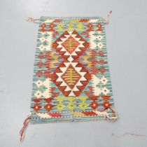 A Chobi Kilim mat. 94x60cm.