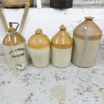 Four large stoneware flagons, tallest 52cm. named to S Keys and Co, Style and Winch ltd,
