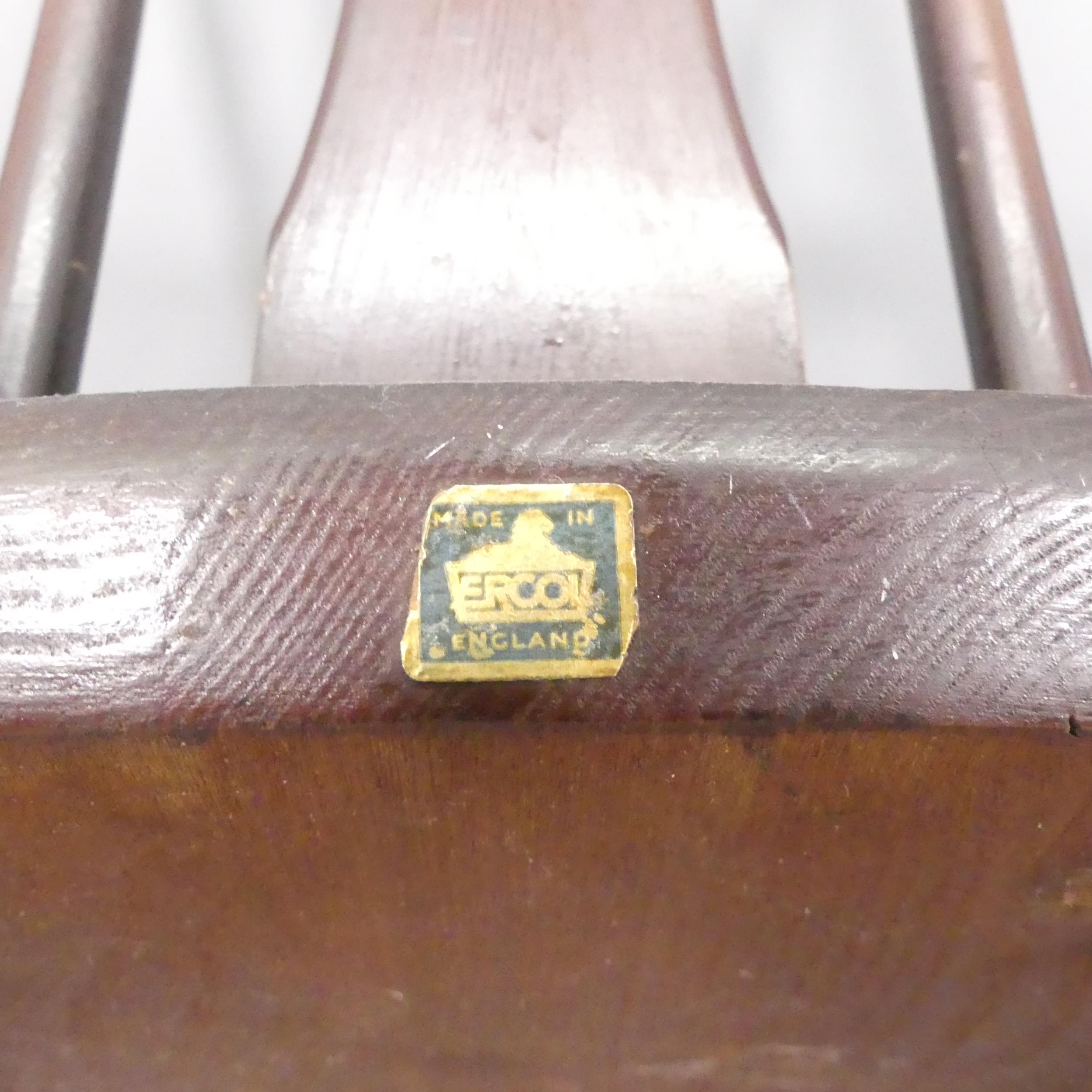 ERCOL - a pair of mid-century Chairmaker's comb-back elbow chairs. With maker's labels. - Image 3 of 3