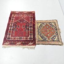 A red ground Persian mat, 112x75cm, and another. (2)