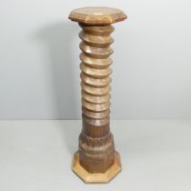 A large antique French elm spiral turned column with carved oak octagonal top, skirt and base.