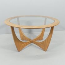 G-PLAN - a mid-century teak Astro coffee table, with inset glass top and maker's label. 84x46cm.