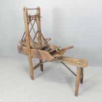 An antique oak wool carding machine. 115x120x36cm.