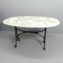 An oval Arabescato Corchia marble topped table on cast iron base. 140x74x100cm.