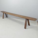 A 19th century oak bench with A frame legs. 274x50x35cm. Good overall condition with signs of age