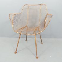 A mid-century Sculptura chair in the manner of Russell Woodard. Good condition. No maker's marks.