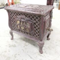 A French cast iron wood burning stove. Overall 56x52x34cm. Lid top top has been broken. Both