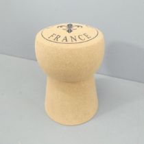 A contemporary champaign cork design stool. 34x51cm.