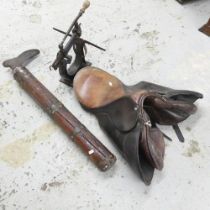A leather saddle, an antique cobbler's anvil and a mechanical press (3).