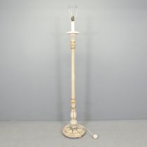 A painted continental style standard lamp, with carved and fluted decoration. Untested.
