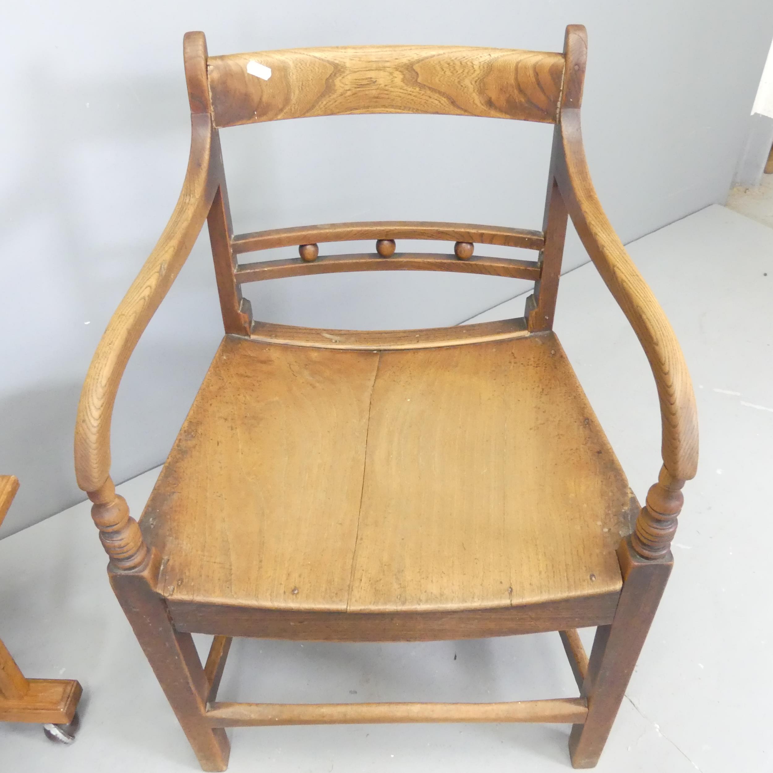 A Georgian oak desk chair with panelled seat, and an oak side table. (2) - Image 2 of 2