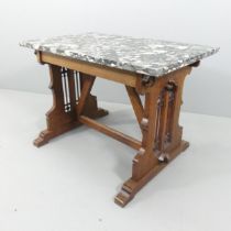 An early 20th century centre table, with polished Marinace granite top on gothic oak trestle base.