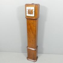 A walnut cased grandmother clock, with key and pendulum. 24x130x17cm.