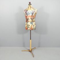 CLIVE FREDRIKSSON - A decoupage decorated mannequin of male form. Height 170cm.