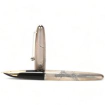 A Pilot, Japan, fountain pen, with sterling silver cap and barrel, engraved with cranes, 14ct