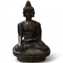 A large Chinese patinated bronze seated Buddha, resting on lotus design base, height 85cm Good