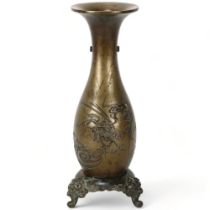 A Chinese heavy bronze vase on stand, decorated with "Longma" the mythical Dragon-Horse, height 29cm