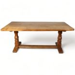 Robert Mouseman Thompson, an oak refectory style dining table, with 4cm thick plank top, raised on