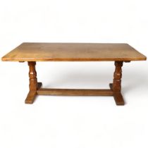 Robert Mouseman Thompson, an oak refectory style dining table, with 4cm thick plank top, raised on