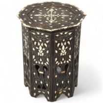 A Middle Eastern octagonal occasional table, with inlaid mother-of-pearl bone and wirework