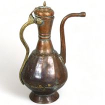 An antique Middle Eastern teapot, hand wrought copper and brass, height 40cm A few small holes at
