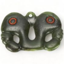A Maori, New Zealand pounamu stone carved pendant, in Pekapeka (native bat) form, length 7cm Good