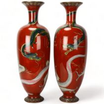 A pair of large Japanese cloisonne baluster vases, with fighting dragon decoration and fine