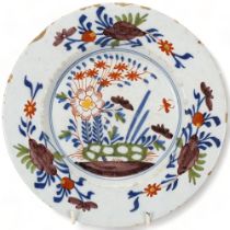 Delft polychrome pottery plate, diameter 23cm Chipped edge and light surface abrasions, no cracks or