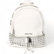 A Michael Kors white leather back pack, with metal studded detail, tow main compartments and