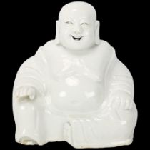A Chinese Blanc de Chine figure of a laughing Buddah, label under base "Ex-Collectis Erik