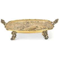A 19th century French solid cast bronze armorial dish, with relief cast heraldic lion design, cast