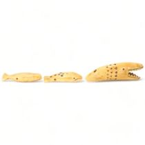 Three Inuit whale bone or tooth carvings, in varied whale forms, longest 8.5cm All in good