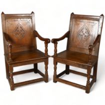 A Pair of 18th/19th century oak armchairs, with carved back panel and turned front legs, height