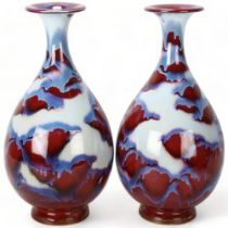 Pair of Chinese mottled sang de boeuf glaze narrow-neck vases, with impressed marks, height 35cm