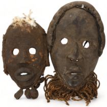 Two African carved tribal masks, Dan, Ivory Coast, longest approx 34cm. Complete original condition,