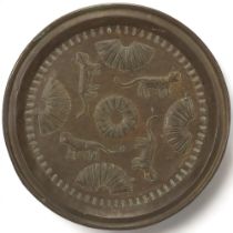 A Benin, Nigeria, bronzed copper tray/charger, with leopard and manilla detail, diameter 48cm